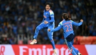 India's Shafali Verma (L) celebrates with her team captain Harmanpreet Kaur after taking the wicket of South Africa's Marizanne Kapp at the DY Patil Stadium in Navi Mumbai on November 2, 2025. (Photo by Punit Paranjpe / AFP)