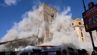 Dust rises due to a second collapse of part of the medieval tower 