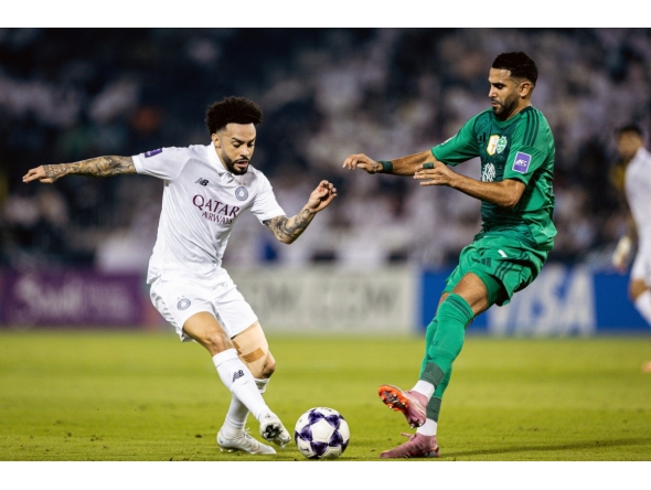 Al Sadd's Claudinho (left) vies for the ball with Al Ahli Saudi FC's Riyad Mahrez.