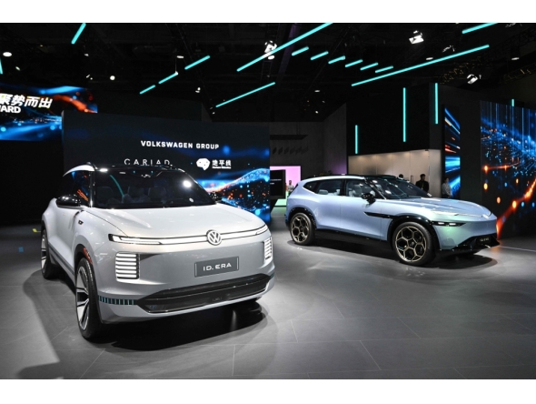 Photo representation of Volkswagen brand as seen at the 8th China International Import Expo (CIIE) in Shanghai. Photo by Hector Retamal / AFP