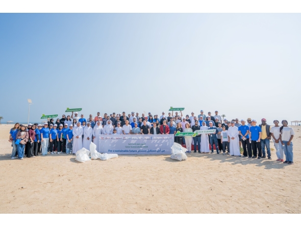 UDST President Dr. Salem Al-Naemi with staff and students during the beach cleanup initiative at Al Wakrah Public Beach.