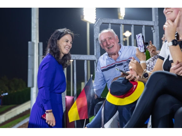 President of the 80th Session of the UN General Assembly Annalena Baerbock speaks with spectators.