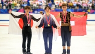 Silver medallist Japan's Shun Sato, gold medallist Japan's Yuma Kagiyama and bronze medallist Switzerland's Lukas Britschgi pose in the medal ceremony for the men's single during the NHK Trophy figure skating competition in Kadoma City. Photo by Philip Fong / AFP
