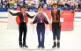 Silver medallist Japan's Shun Sato, gold medallist Japan's Yuma Kagiyama and bronze medallist Switzerland's Lukas Britschgi pose in the medal ceremony for the men's single during the NHK Trophy figure skating competition in Kadoma City. Photo by Philip Fong / AFP