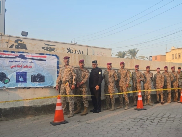 Security personnel waiting in line to vote in Iraq
