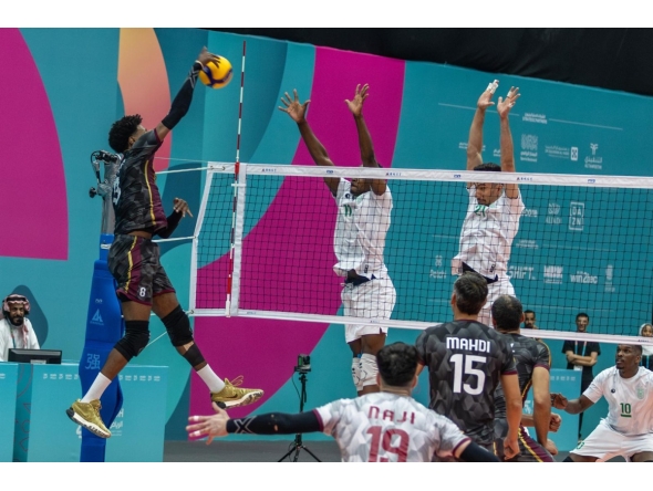 A Qatar player shoots to score against Saudi Arabia.