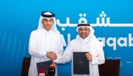 QIIB Deputy CEO Jamal Abdullah Al-Jamal and Al Shaqab Deputy CEO Khalid Al Hitmi pose for a photo after signing the agreement. 