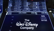 A logo for The Walt Disney Company is displayed on a trading post during the opening bell on the floor of the New York Stock Exchange (NYSE), in New York on May 14, 2019. Photo by Drew ANGERER / GETTY IMAGES NORTH AMERICA / AFP