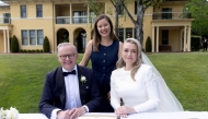 Australia Prime Minister Anthony Albanese (L) and his new wife Jodie Haydon (R) sign the marriage certificate with celebrant Bree during their wedding ceremony in Canberra on November 29, 2025. (Photo by Mike Bowers / AFP)