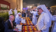 General Manager of Katara Prof. Dr. Khalid bin Ibrahim Al Sulaiti and Professor Waldemar Pfoertsch sign copies after the launch event. 