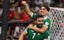 Omar Khribin (foreground) celebrates with a teammate after scoring a goal. 