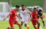 Action during the match between UAE and Oman.