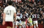 Aston Villa's Argentinian midfielder #10 Emiliano Buendia is mobbed by teammates after scoring the team's second goal during the English Premier League football match between Aston Villa and Arsenal at Villa Park in Birmingham, central England on December 6, 2025. (Photo by JUSTIN TALLIS / AFP)
