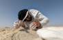 Ferhan Sakal from Qatar Museums applies plaster bandages to protect the fossils of a 21-million-year-old sea cow from the Al Maszhabiya site in southwestern Qatar. Picture: Nicholas D. Pyenson / Smithsonian Institution
