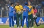 South Africa's Lungi Ngidi (2L) and Corbin Bosch (2R) congratulate India's Shubman Gill and Tilak Varma for their team's win at the end of the fifth Twenty20 international cricket match between India and South Africa at the Narendra Modi Stadium in Ahmedabad on December 19, 2025. (Photo by Shammi Mehra / AFP) 