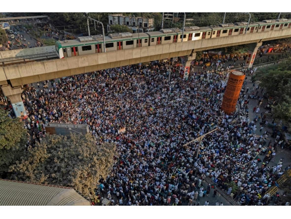 An aerial view shows protesters at Shahbagh intersection in Dhaka on December 19, 2025, following the death of youth leader Sharif Osman Hadi. (Photo by Abdul Goni / AFP)