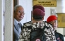 Former prime minister of Malaysia Najib Razak (L) arrives for a court hearing where he seeks to land a ruling allowing him to serve the rest of his six-year sentence under house arrest instead of in the Kajang Prison, at the Kuala Lumpur High Court in Kuala Lumpur on December 22, 2025. (Photo by Mohd Rasfan / AFP)
