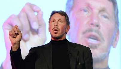 Larry Ellison, CEO of Oracle Corporation, gestures as he makes a speech during the New Economy Summit 2014 in Tokyo on April 9, 2014. Photo by TORU YAMANAKA / AFP