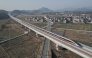An aerial drone photo taken on Dec. 26, 2025 shows the C3132 passenger train bound for Hangzhou running along the Hangzhou-Quzhou high-speed railway in east China's Zhejiang Province. (Xinhua/Huang Zongzhi)
 