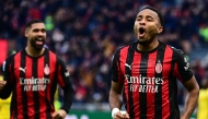 AC Milan's French forward #18 Christopher Nkunku celebrates after scoring his team second goal against Hellas Verona at the San Siro stadium in Milan. (Photo by Piero CRUCIATTI / AFP)