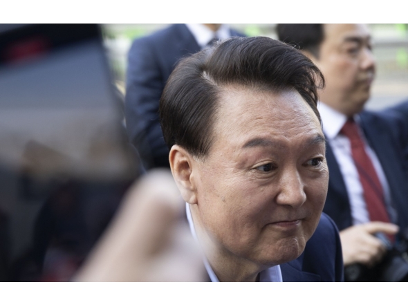 Ousted South Korean president Yoon Suk Yeol (L) leaves the official residence in Seoul on April 11, 2025. (Photo by JEON HEON-KYUN / POOL / AFP)

