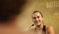 Belarus' Aryna Sabalenka speaks during a news conference in Dubai on December 28, 2025. (Photo by Amr Alfiky / Pool / AFP)
