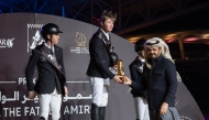 Qatar Olympic Committee President and President of the Organising Committee of the Doha Equestrian Tour H E Sheikh Joaan bin Hamad Al Thani crowned the podium winners of the CSI4* 1.55m Jump-Off Grand Prix on the final day of the opening Tour of the H H The Father Amir’s Prix at Al Shaqab’s Longines Outdoor Arena yesterday. 