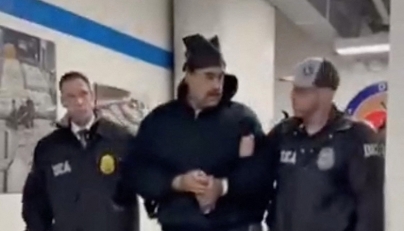 This screengrab taken from the X account of Rapid Response 47, the official White House rapid response account, shows Venezuelan President Nicolas Maduro (C) escorted by DEA agents inside the headquarters of the US Drug Enforcement Administration (DEA) in lower Manhattan, New York, on January 3, 2026. (Photo by X account of Rapid Response 47 / AFP)
