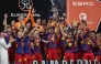 Barcelona's players raise the trophy as they celebrate after winning the Spanish Super Cup final football match between FC Barcelona and Real Madrid at the King Abdullah Stadium in Jeddah on January 11, 2026. (Photo by Fadel SENNA / AFP)