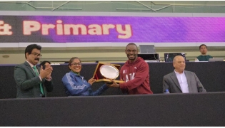 Birla Public School officials honouring Femi Seun Ogunode during the event.