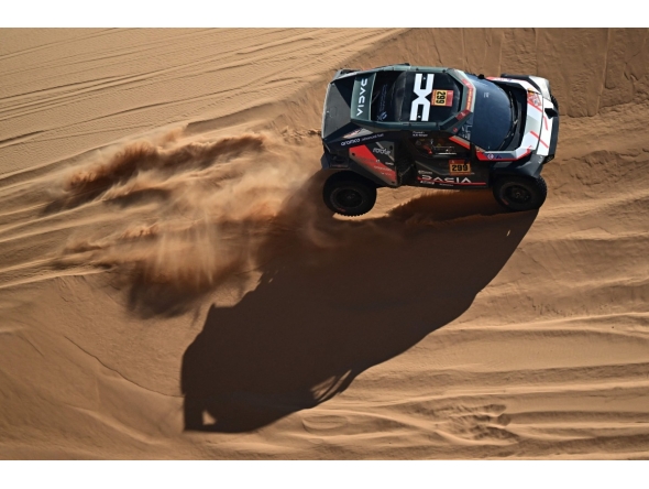 The Dacia Sandriders' Qatari driver Nasser Al Attiyah and Belgian co-driver Fabian Lurquin compete in Stage 8 of the 48th Dakar Rally. AFP