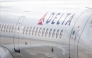 A Delta Airlines plane is stationed at a gate at the Austin-Bergstrom International Airport on January 12, 2026 in Austin, Texas. Photo by Brandon Bell / GETTY IMAGES NORTH AMERICA / Getty Images via AFP