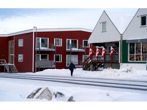 Greenlandic flags are fixed on a building in Nuuk, Greenland, on January 14, 2026.  (Photo by Alessandro Rampazzo / AFP)