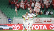 Al Gharafa's Joselu (right) celebrates with teammate Yacine Brahimi after scoring a goal.