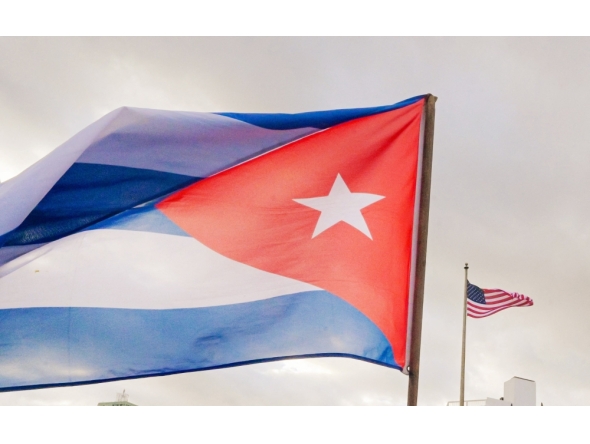 A Cuban soldier waves a national flag in front of the US Embassy in Havana on January 16, 2026. (Photo by Adalberto Roque / AFP)