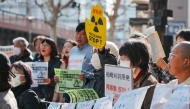 Participants demonstrate in front of Tokyo Electric Power Company's headquarters, against the restart of the Kashiwazaki-Kariwa Nuclear Power Plant, in Tokyo on January 19, 2026. (Photo by Kazuhiro NOGI / AFP)
