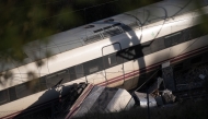 A picture taken on January 19, 2026 shows a view of one of the two trains that derailed the day before, killing at least 39 people and injuring more than 120, in Adamuz, southern Spain. Photo by JORGE GUERRERO / AFP
