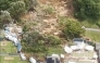 This screen grab made from UGC footage shows the site of a landslide in Mount Maunganui. A landslide smashed into a campsite in rain-swept northern New Zealand on January 22, leaving multiple people missing under tonnes of mud. (Photo by Handout / Amy Till, Solsea Swim / AFP) 