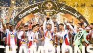 Sharjah players celebrate with the Qatar-UAE Super Cup.  
