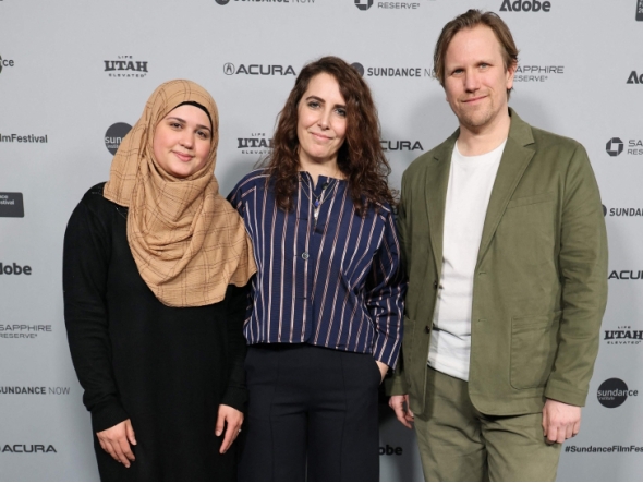 (L-R)  Isra'a, Itab Azzam and Jack MacInnes attend the 