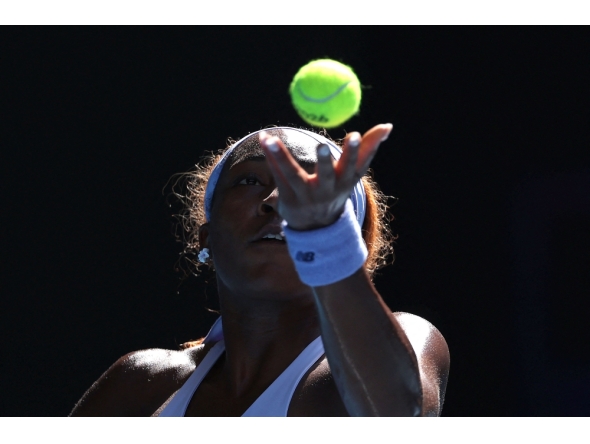 USA's Coco Gauff serves to Czech Republic's Karolina Muchova during their women's singles match on day eight of the Australian Open tennis tournament in Melbourne on January 25, 2026. (Photo by Martin Keep / AFP)