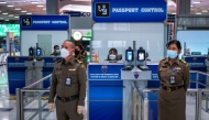 File photo. Immigration police officers are seen during a readiness inspection in preparation for the country's reopening on November 1, at Suvarnabhumi International Airport in Bangkok, Thailand, October 20, 2021. REUTERS/Athit Perawongmetha