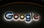 This photograph taken on January 22, 2026, shows a sign of US technology company Google displayed during the World Economic Forum (WEF) annual meeting in Davos. (Photo by Fabrice COFFRINI / AFP)
