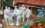 Representational file photo. Doctors and relatives wearing protective gear dig a grave to bury a victim of the brain-damaging Nipah virus in Kozhikode, Kerala, India, May 24, 2018. Reuters/Stringer