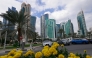Cars drive along the Corniche area on a cloudy day in Doha on January 26, 2026. (Photo by Karim JAAFAR / AFP)

