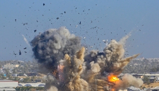 File photo. Representational. Smoke rises from the Gath shelter, housing displaced Palestinians, after an Israeli air strike in the west of Khan Yunis, southern Gaza Strip on January 31, 2026. (Photo by Bashar Taleb / AFP)