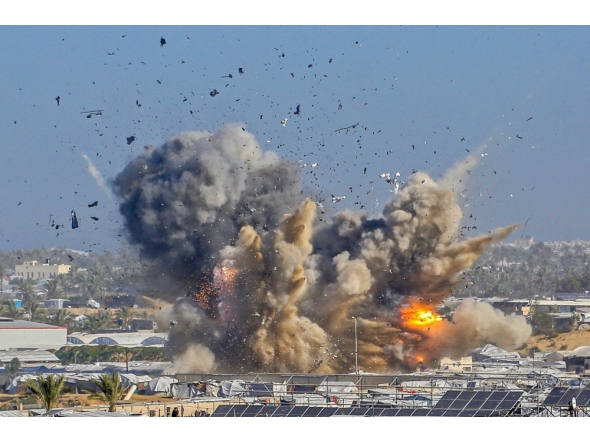 Smoke rises from the Gath shelter, housing displaced Palestinians, after an Israeli air strike in the west of Khan Yunis, southern Gaza Strip on January 31, 2026. (Photo by Bashar Taleb / AFP)