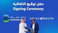 Dukhan Bank and DriveWealth officials during the signing ceremony.