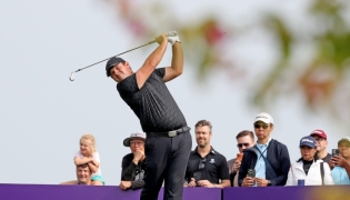 US golfer Patrick Reed plays a shot during the third day of the Qatar Masters at Doha Golf Club. 