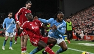 Manchester City's Ghanaian midfielder #42 Antoine Semenyo (R) fouls Liverpool's French defender #05 Ibrahima Konate (front L) which results in a free kick during the English Premier League football match between Liverpool and Manchester City at Anfield in Liverpool, on February 8, 2026. (Photo by Paul ELLIS / AFP)